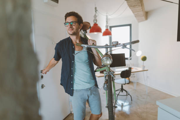 istock Young man coming to his workplace 857888234