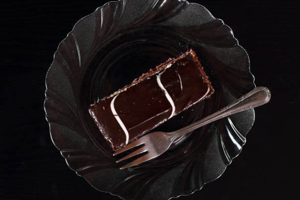 istock Layer cake with fruit and cream fillings decorated chocolate icing 857888980