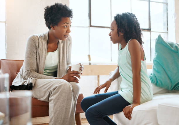 Responsibility comes first Shot of a mother and daughter at home serious talk stock pictures, royalty-free photos & images