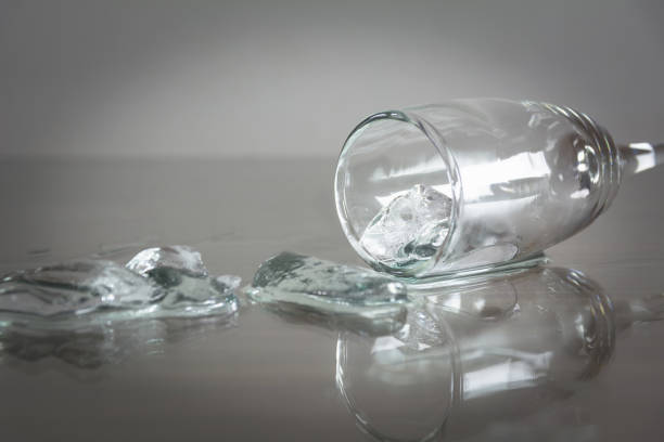 istock Spilled water with ice cubes on table. Glass with spilled water and ice cube. 857896404