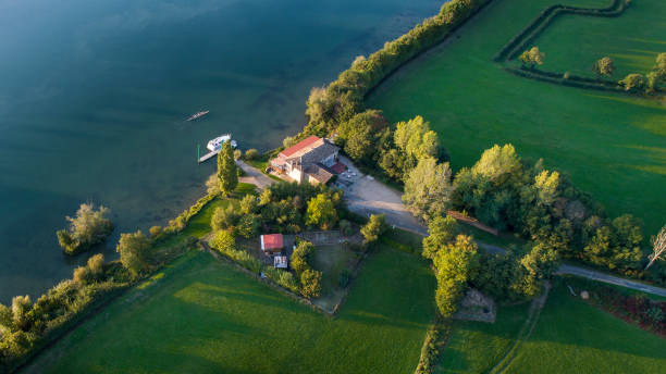 istock River, farmers building and fields - aerial view 857897346