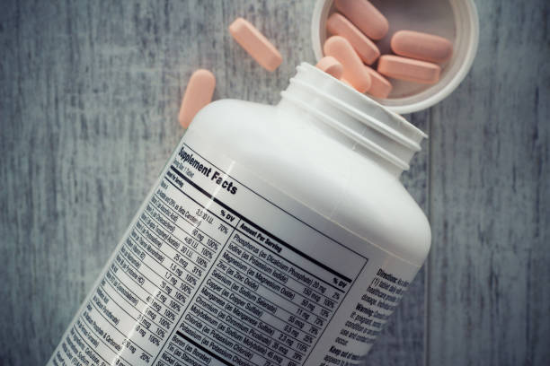 Supplement facts, Closeup of a bottle of vitamins stock photo