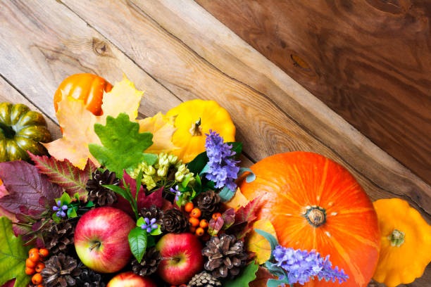istock Thanksgiving decoration with pumpkin, apples, lilac flowers 857901714