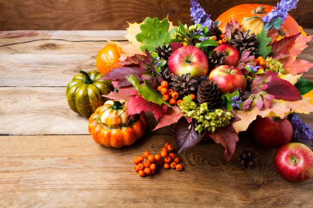 istock Thanksgiving greeting background with ripe apples, blue flowers 857901838
