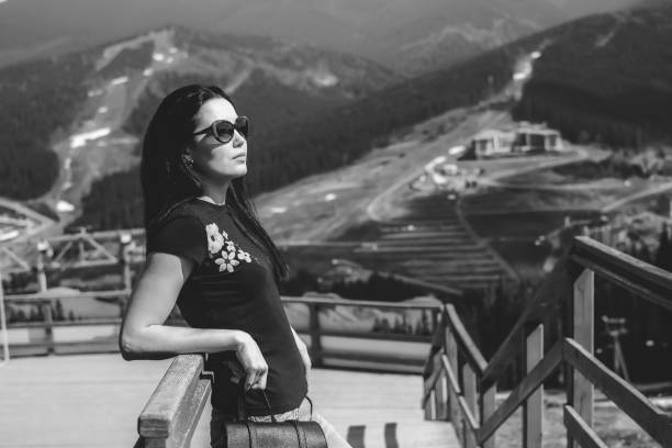 istock Woman with backpack in the mountains 857904888