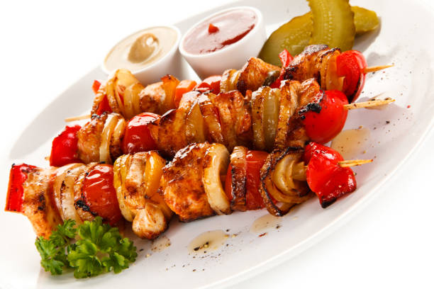 istock Kebabs - grilled meat and vegetables on white background 857905260