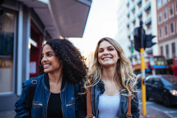 istock Two women walking in the city 857908694