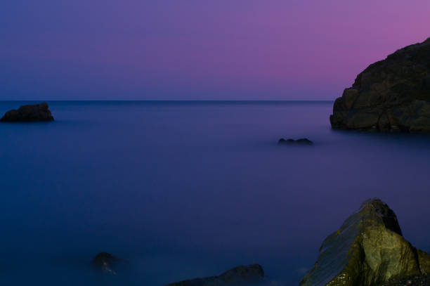 istock The sea and the stones after sunset 857909096