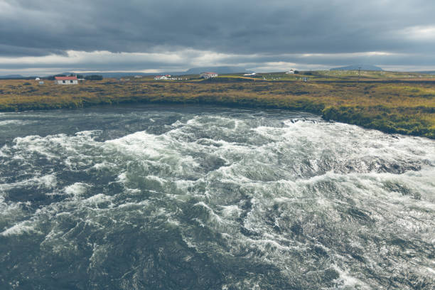 Summer Iceland Landscape with Raging River at Overcast Weather