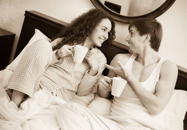 istock Positive boyfriend and  girlfriend drinking coffee 857912500