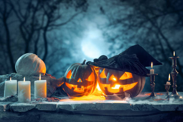 istock Halloween pumpkins on blue background 857912530