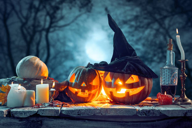 istock Halloween pumpkins on blue background 857913134