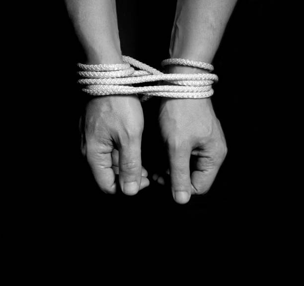 istock Male hands bound with rope 857913374