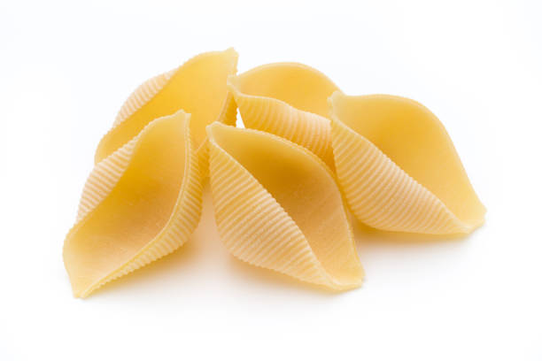 istock Italian lumaconi isolated on white background. 857913716