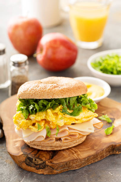 istock Breakfast bagel with scrambled eggs and turkey 857913788