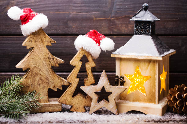 istock Burning lantern and christmas decoration in the evening. 857916078