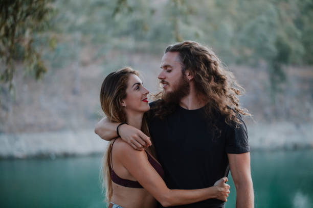 istock Real couple embraced and looking at each other 857916534