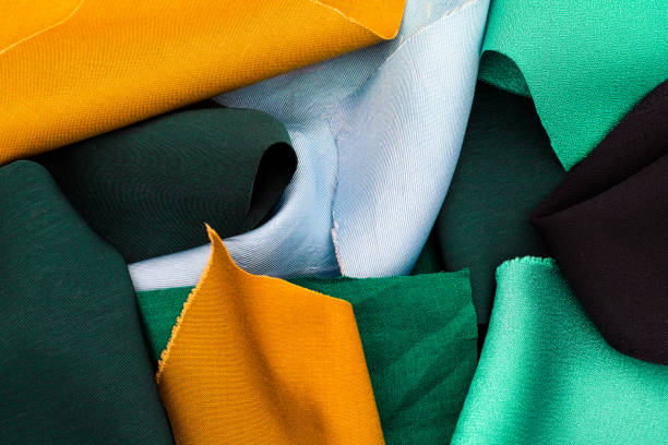 istock Pieces of yellow, green and blue textile. 857916754