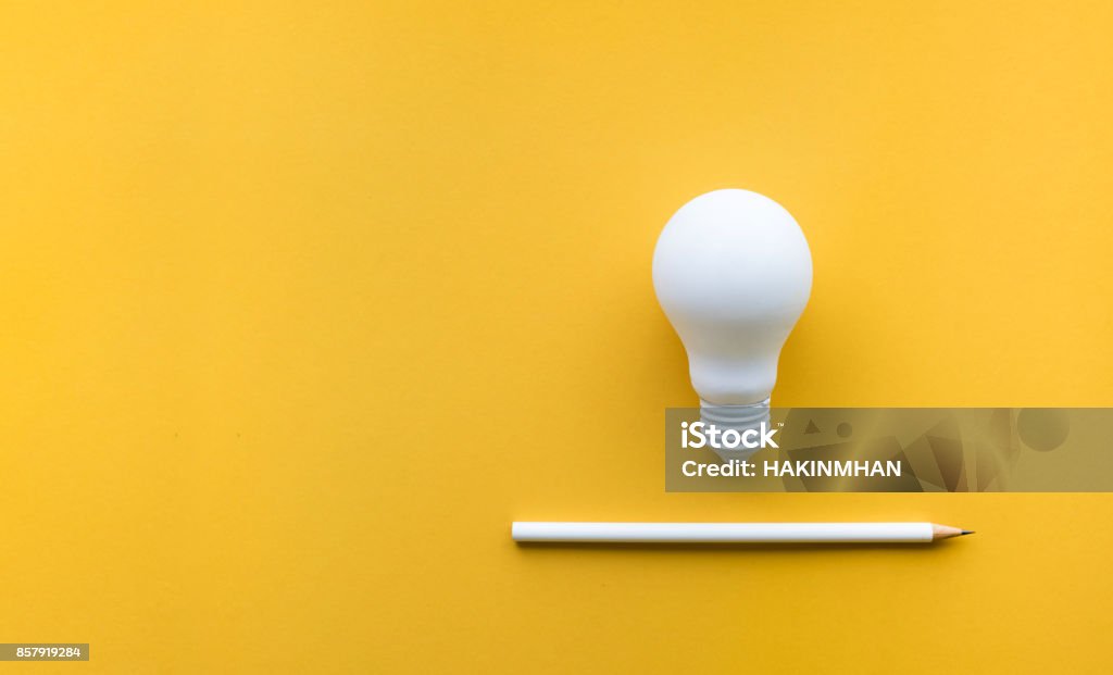 Creativity inspiration,ideas concept with lightbulb Creativity inspiration,ideas concepts with lightbulb and pencil on pastel color background.Flat lay design. Creativity Stock Photo