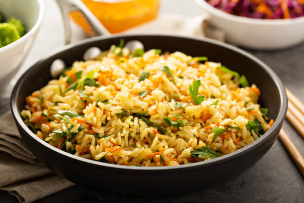 istock Fried rice with vegetables and steamed broccoli 857920196
