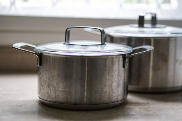 istock old aluminum stainless steel cooking pot on kitchen table 857923962