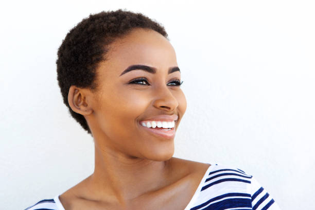istock Close up young back woman smiling against white background 857924604