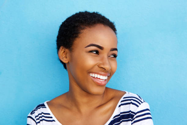 istock Close up smiling young black woman looking away 857924826