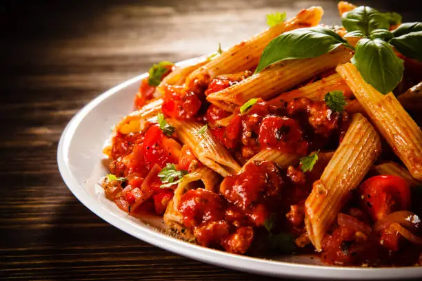 Photo of Pasta with meat, tomato sauce and vegetables