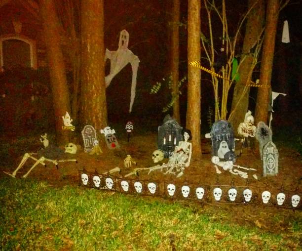 Halloween Decorations on Front Lawn at Night stock photo