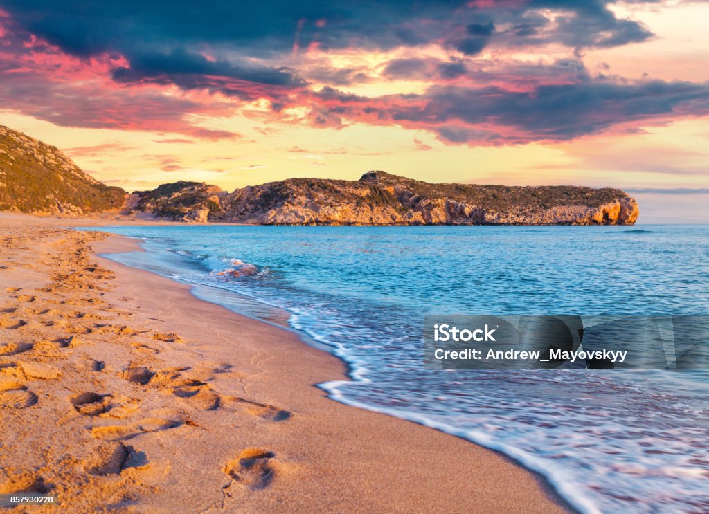 Footprints in the sand on the famous Turkish beach Patara Footprints in the sand on the famous Turkish beach Patara. Colorful sunset in the Turkey, District of Kas, Antalya Province, Asia. Artistic style post processed photo. Beach Stock Photo