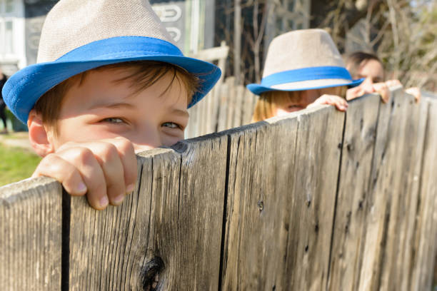 istock Cute Boy on Fence 857932672