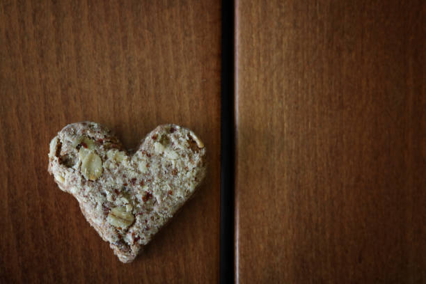 istock Heart Cookies on wooden table 857933756