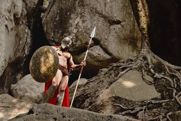istock Confident muscular warrior in gladiator outfit 857943238