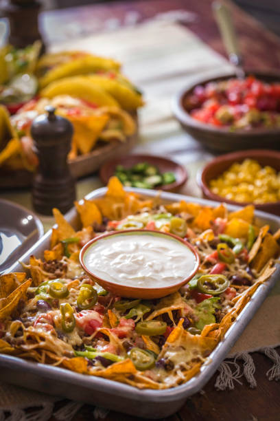 istock Baked Nachos Tortilla Chips with Salsa, Minced Meat and Jalapenos 857944164
