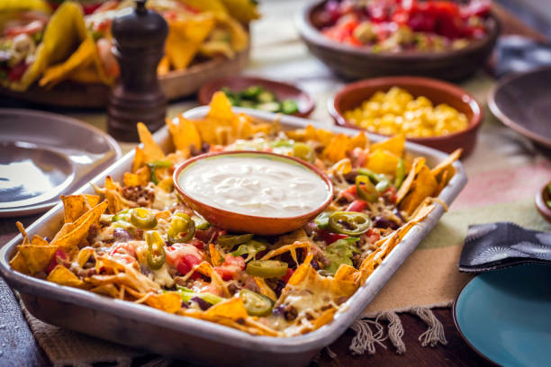 istock Baked Nachos Tortilla Chips with Salsa, Minced Meat and Jalapenos 857944166