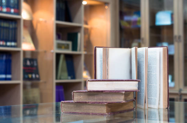 istock old book on the glass desk in library 857955542