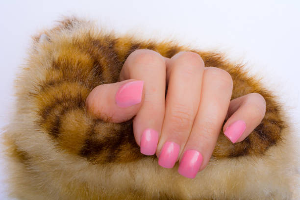 istock Pink nails in warm faux fur coat 857966230