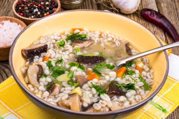 istock Soup with pearl barley and forest mushrooms 857966384
