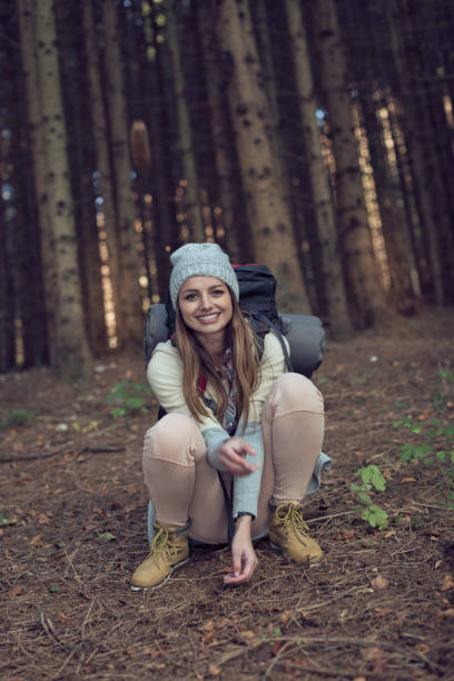 istock Woman crouching in the woods. 857972616