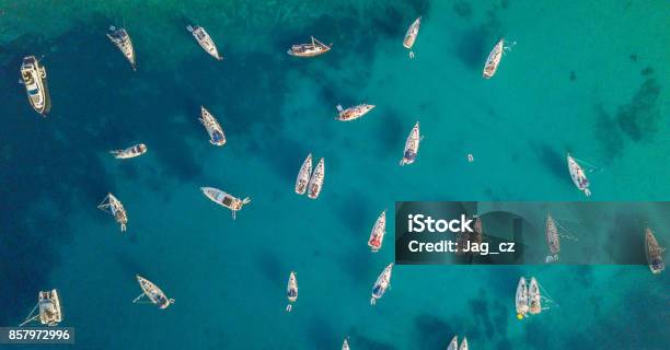 Aerial View Of Group Of Sailing Boats Anchoring On Buoys Stock Photo - Download Image Now