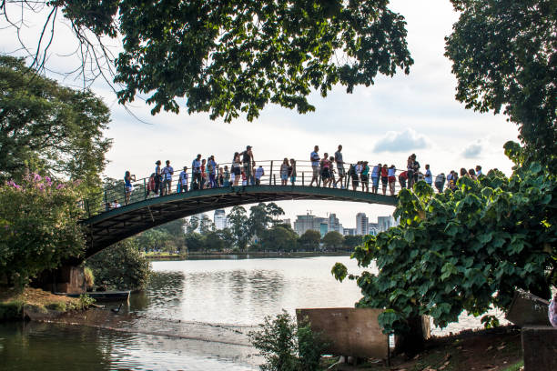 São Paulo, Brazil, April, 23, 2011. People walking on the iron bridge in Ibirapuera Park
