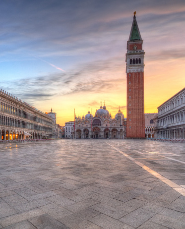 Beautiful sunrise on famous st.Marco square with clock tower in Venice, Italy, Europe. Historical heritage.