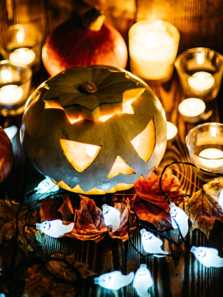 istock Halloween jack-o-lanterns burning in darkness 857978770