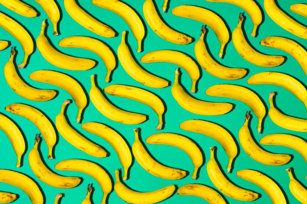 istock Fresh ripe bananas on green background 857984556