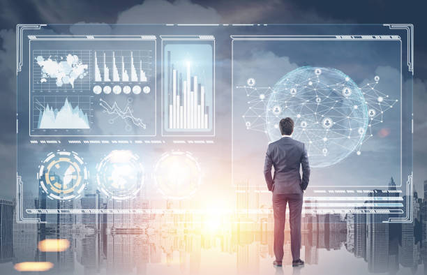 istock Man looking at infographics holograms, city 857984714