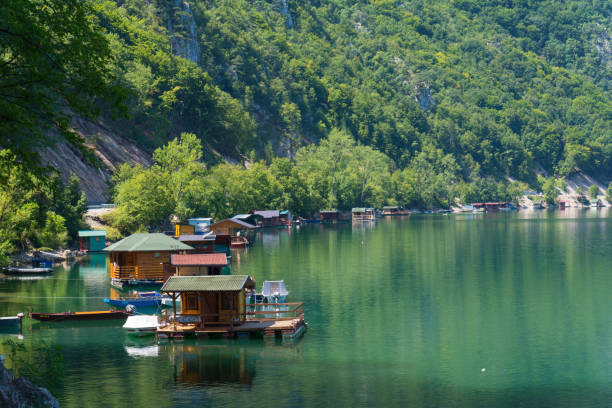 Houseboats of Perucac lake Perucac, Serbia July 31, 2017: Houseboats of Perucac lake, Tara National Park (Serbia) small houseboats stock pictures, royalty-free photos & images