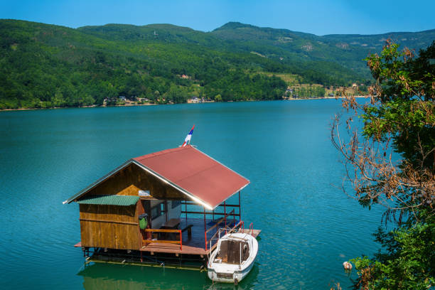 Houseboats of Perucac lake Perucac, Serbia July 31, 2017: Houseboats of Perucac lake, Tara National Park (Serbia) small houseboats stock pictures, royalty-free photos & images