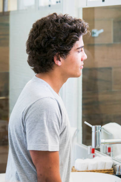 istock Teenage boy at bathroom 857989448