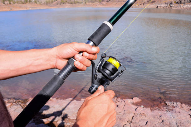 istock Fishing with rod on lake 857995982