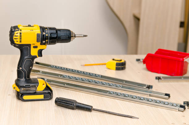 istock Assembling of furniture closeup 857996290